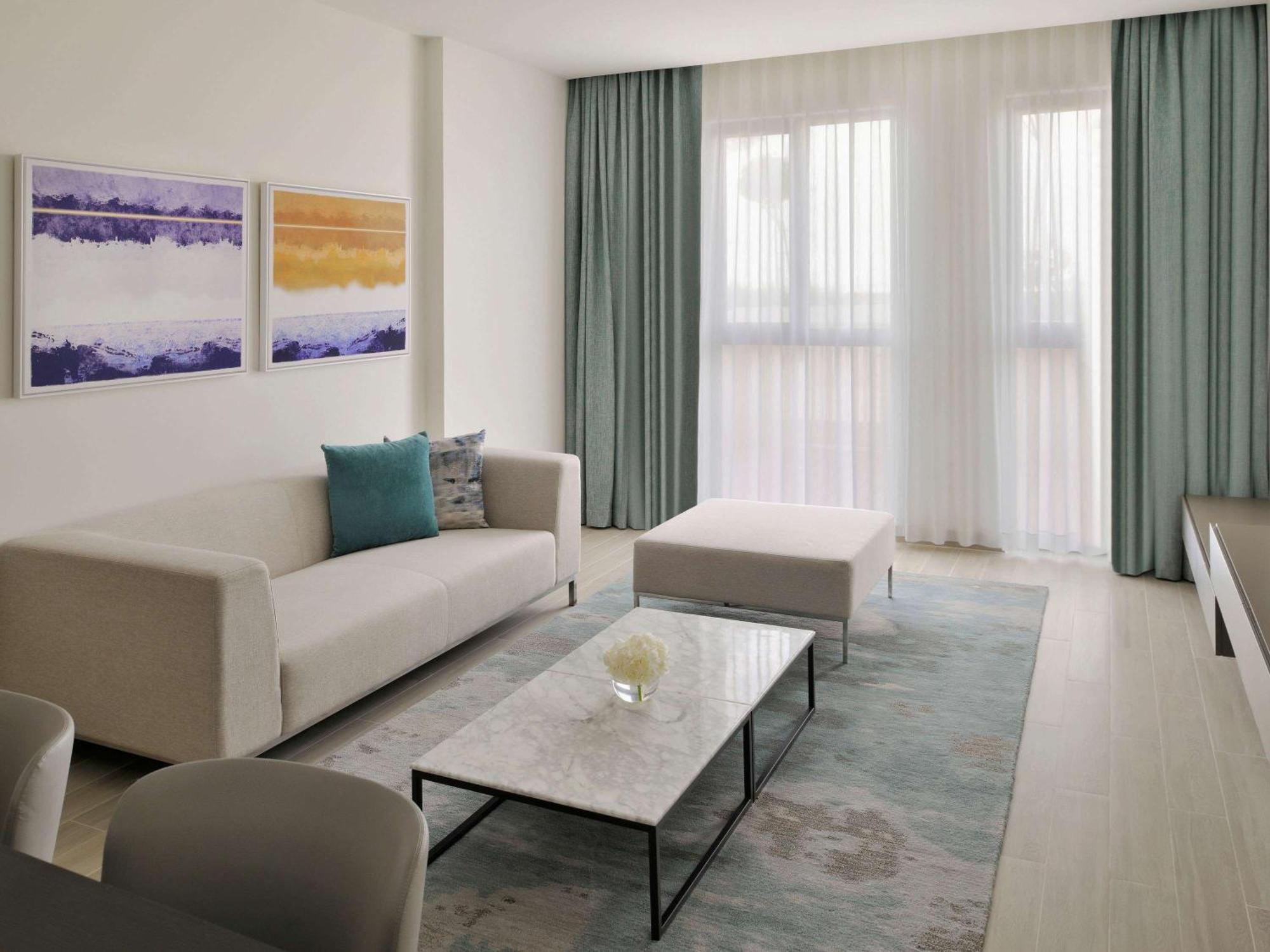 Moevenpick Hotel & Apartments Ghala Mascate Extérieur photo A living room